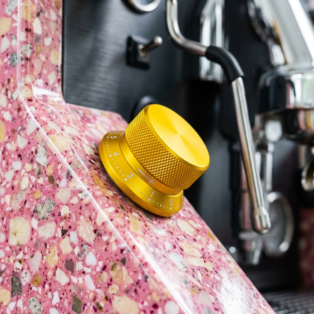 Close-up of the yellow anodized dial on the CONFETTO espresso machine